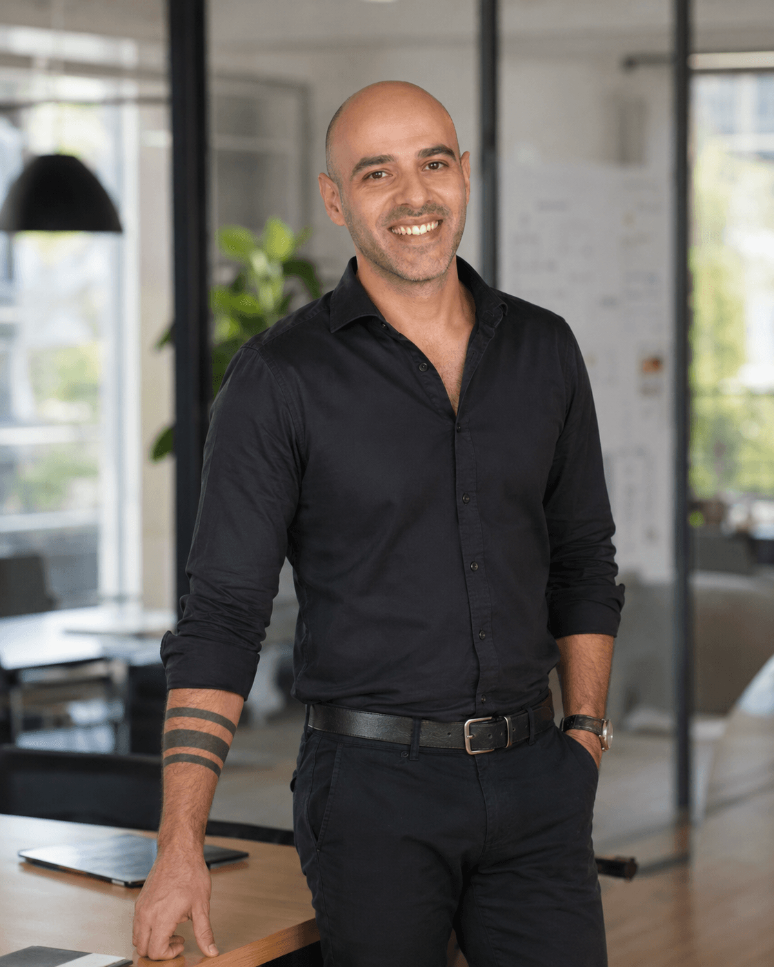 The founder of Text2Task in a modern workspace